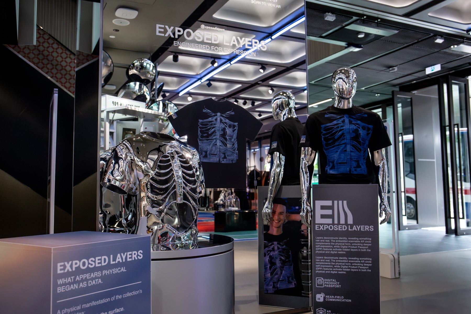 Exposed Layers popup with the ribcage shirt, chrome form and AR signage